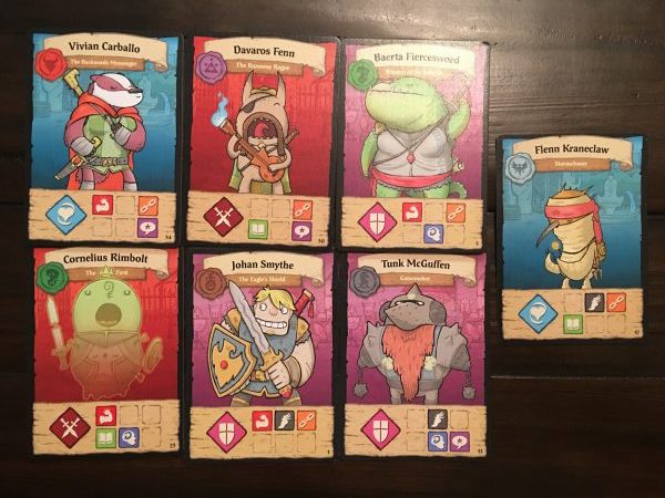 Hero cards from the game By Order of the Queen, laid out in a grid of 2x3 with one card to the right. 