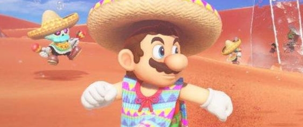 Mario in a rainbow poncho and sombrero, running away from something to the right.