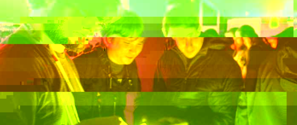 A glitched out yellow and orange image of three men playing