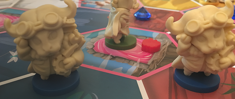 two small cream colored creatures on a board game