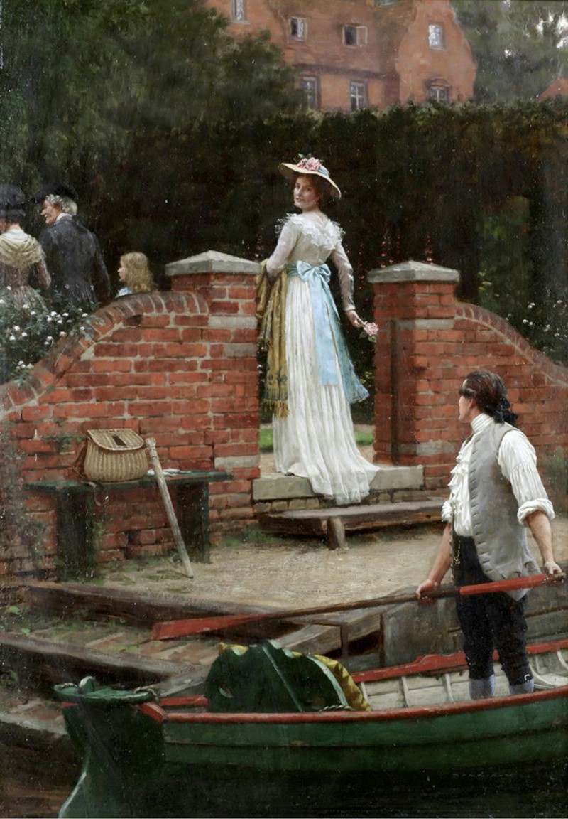 A woman looks out in a brick area of an English garden.