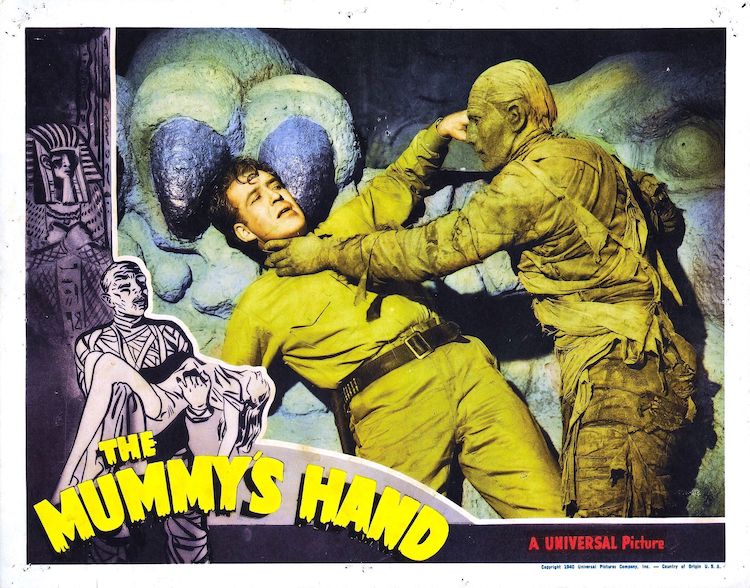 On the poster art for The Mummy's Hand, a mummy reaches for an explorer's throat.