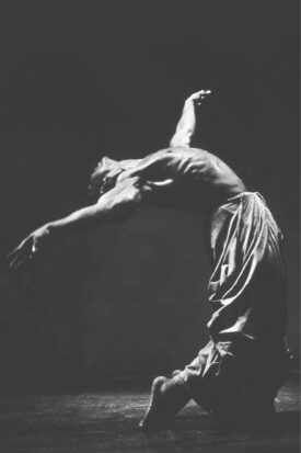 A photograph of Alvin Ailey Jr. dancing.