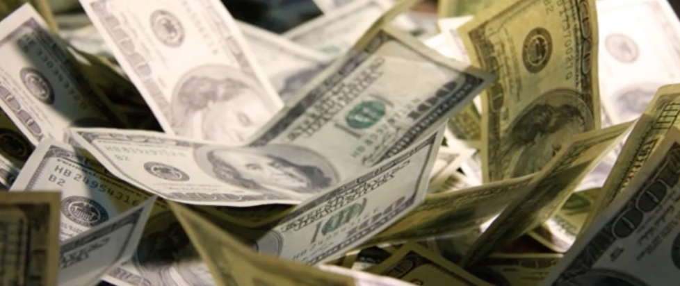 A close-up of many $100-dollar bills.