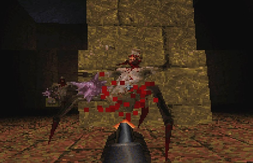 A spider-like monster sprays pixellated blood as it's shot from a first-person perspective.