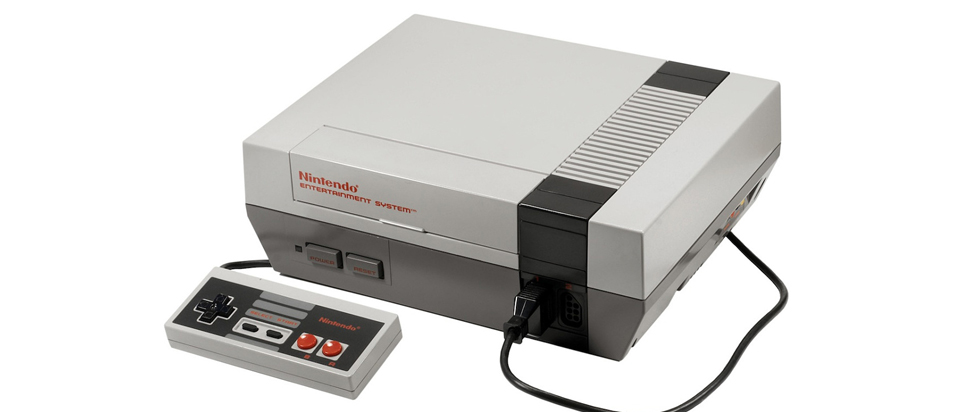 A blocky gray and black Nintendo Entertainment System console from the late 80s.