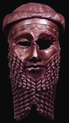 The Mask of Sargon: a bronze bust depicting a man with braided beard and hair. The left eyehole is broken and wider than the other.