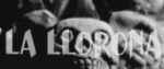 The title screen for La Llorona, with the name of the movie opaquely set over a glowering sculpture of a skull