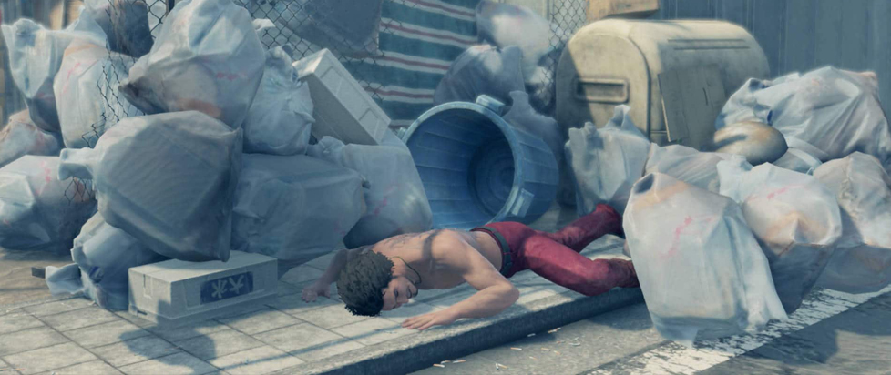 In a screenshot from the videogame Yakuza: Like a Dragon, a shirtless man lies prone in a pile of rubble.