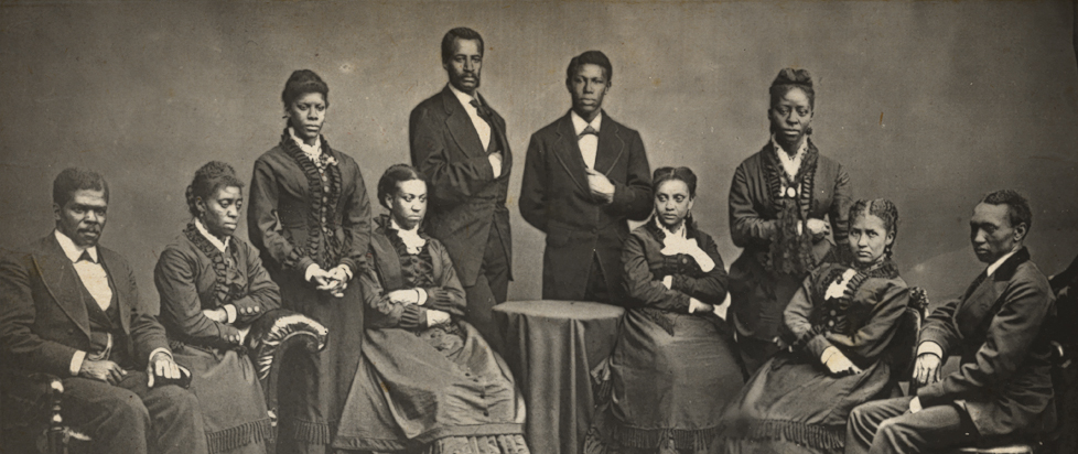 A sepia-toned photograph of the Fisk Jubilee Singers, an African-American a capella group from Fisk University.