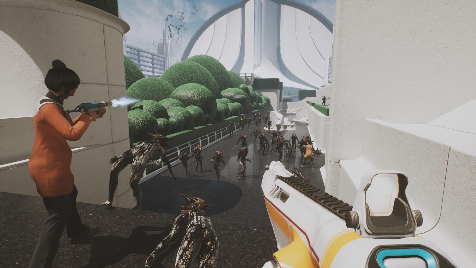 A scene from The Anacrusis from the player's perspective – behind the sights of a laser rifle. Several alien enemies barrel towards the player while a teammate readies herself with her own rifle off to the side.