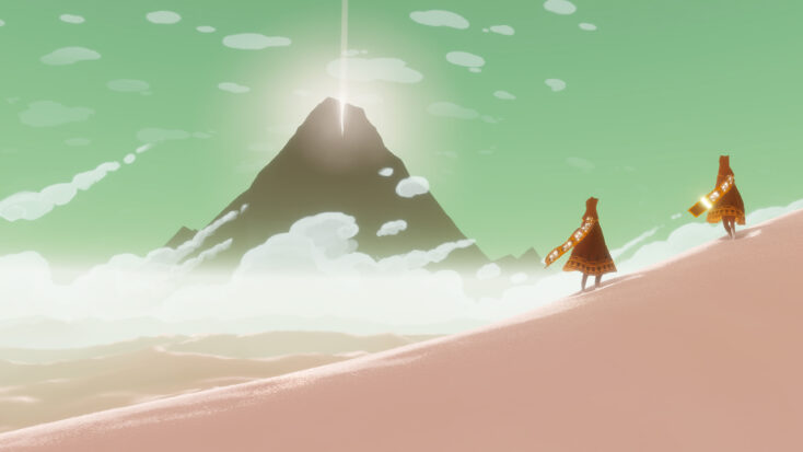 In a screenshot from the videogame Journey, two cloaked travelers gaze towards a distant mountain with a shining beacon of light on top.