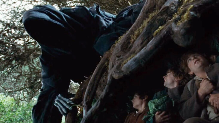 In a scene from The Lord of the Rings: The Fellowship of the Ring, Frodo and friends hide beneath gnarled tree roots as a Nazgûl leans forward above them, the hobbits just barely out of its line of sight. 