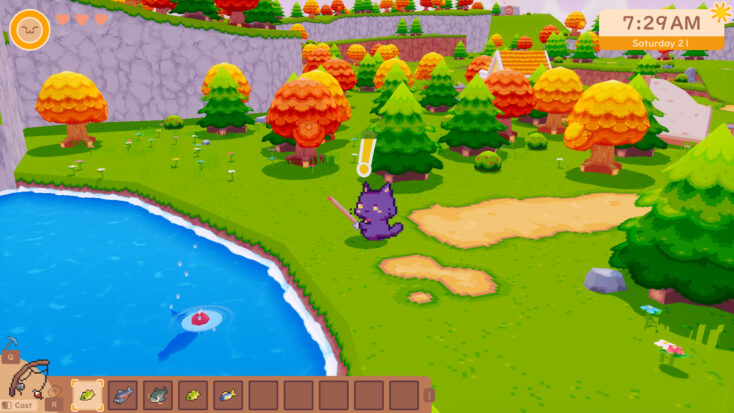 A small purple cat fishes at a pond surrounded by Autumnal trees.