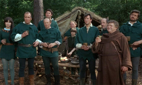 A bunch of lads in the forest just vibing in green tunics, except for Little John who's beaming in his monk's robes