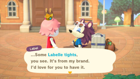 Label looks up at Trevor's character with a smile, as Trevor wears a red top and a crown. Label says "... Some Labelle tights, you see. It's from my brand. I'd love for you to have it."