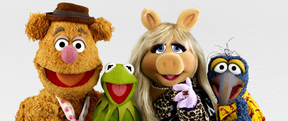 Fozzie Bear, Kermit the Frog, Miss Piggy and Gonzo of The Muppets smile for a group photo.