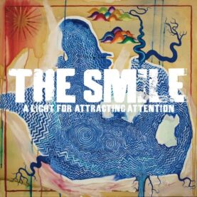 The album cover art for The Smile's A Light for Attracting Attention, featuring an abstract blue swirling shape set in a field of ochre and orange.