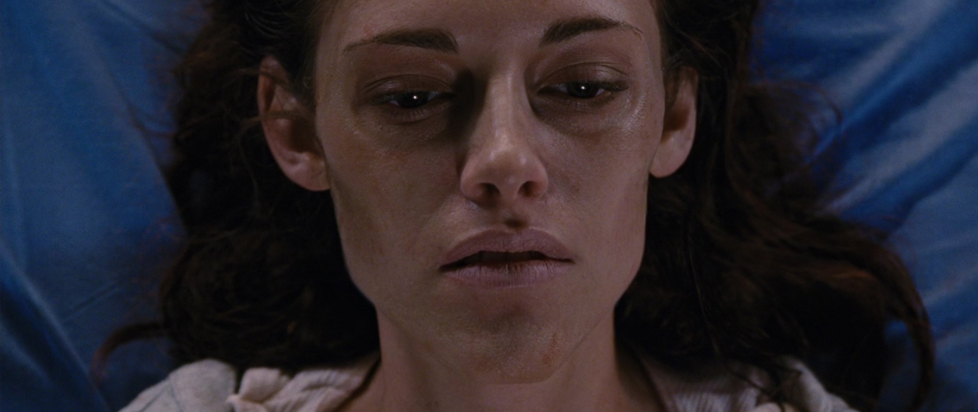 A still from Breaking Dawn shows a close-up of Bella Swan at the end of her pregnancy. Her face is gaunt and skeletal.
