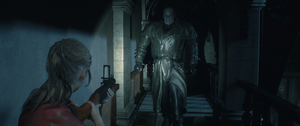 A screenshot from Resident Evil 2 shows Clare pointing a gun at Mr. X, a huge imposing man in a black leather trench coat