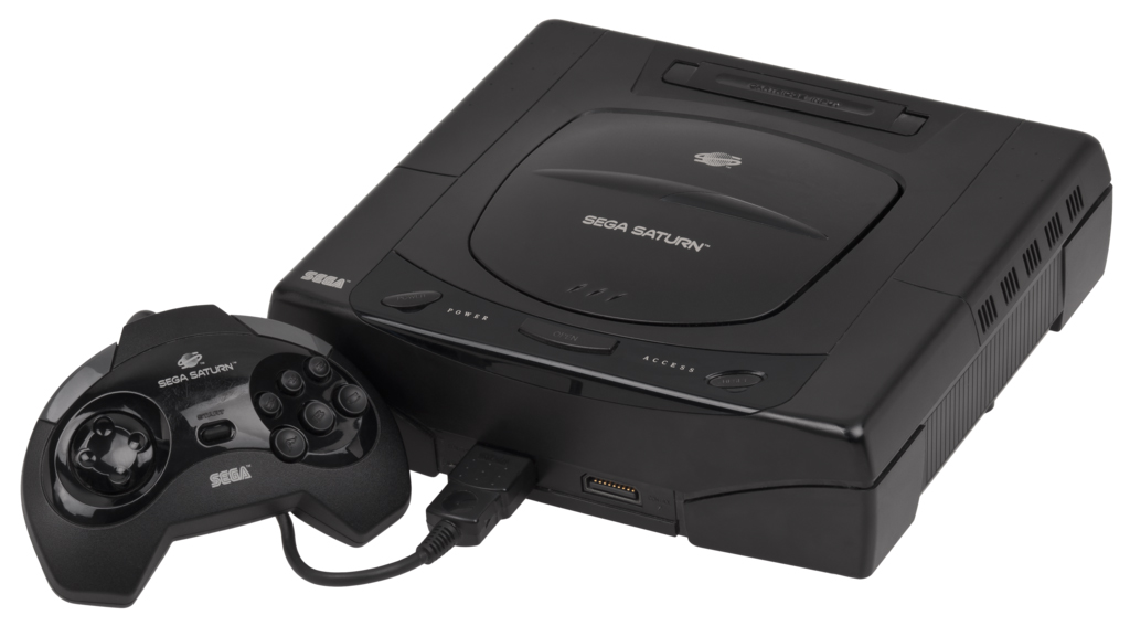 A photograph of the Sega Saturn home console system and its wired controller.