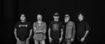 The band Lucero in all their middle-aged glory, looking cool in a classic black-and-white band photo.
