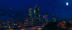 A late evening city skyline from Grand Theft Auto 5 with lit-up office buildings silhouetted against a dusky sky.
