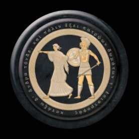 The cover for the Mountain Goats' "Jenny from Thebes" features a black and gold Greek shield.