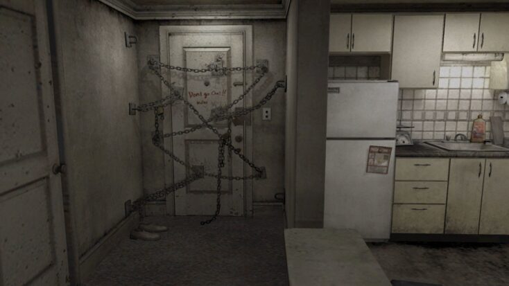 A Silent Hill screenshot shows a dingy apartment kitchen situated next to the interior of the apartment's front door, alarmingly chained shut with "don't go out" scrawled hastily across it in red paint or blood.