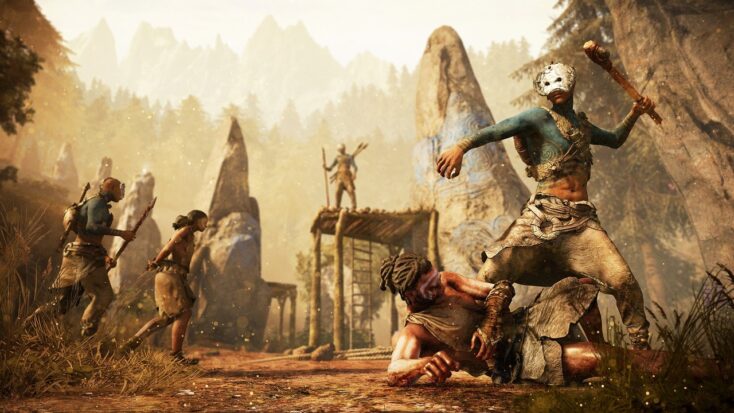 Key art from Far Cry Primal shows two men engaged in combat, with one on the ground and the other raising a blunt weapon over his head. In the background, another man stands on a platform with staff in hand.