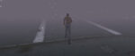 A screenshot from Silent Hill shows protagonist James running into the misty distance.