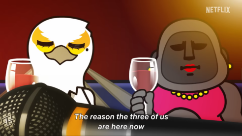 A screenshot from Aggretsuko where Retsuko's friends Washimi and Gori sit with a microphone in front of them like a threat or a promise