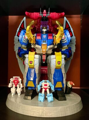 A magnificent specimen of a transforming toy, a true mechanical behemoth that towers over its punier brethren (some of which are displayed at its feet!).