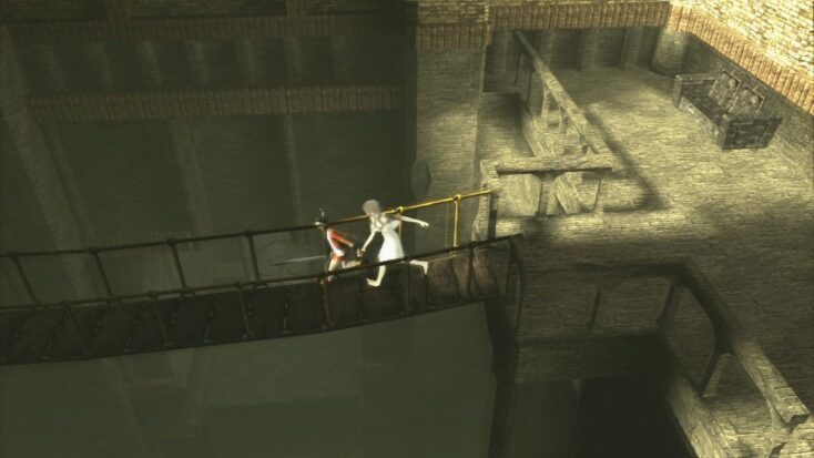 A screenshot from Ico shows Ico and Yorda running across a rickety bridge suspended over a dark chasm.