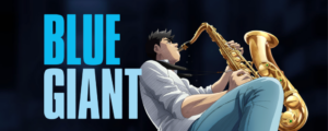 Art from the movie Blue Giant with the title on the left and a young saxophone player in jeans on the right photographed from a low angle just wailing on his horn