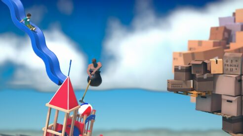 A screenshot from Getting Over It where the Player is bouncing off of a piece of playground equipment towards a mountain of cardboard boxes with an idyllic ocean scene in the background