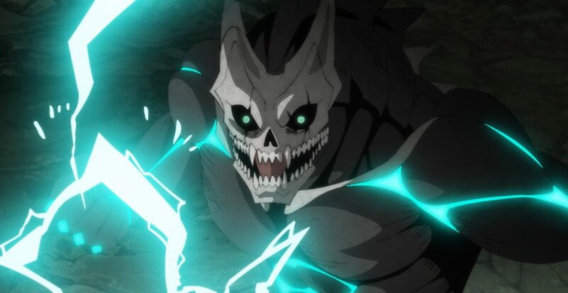The eponymous beast from Kaiju No. 8 stares forward while preparing an attack of blue electricity, its face resembling a grinning animal skull.