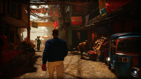 A screenshot from the world tour mode of Street Fighter 6 with a young black character walking through an alleyway with flags, fruit sellers, and other citizens enjoying the day