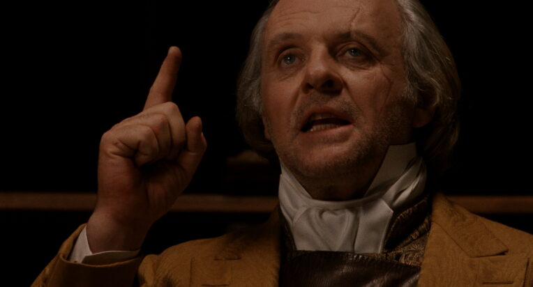 A still from Bram Stoker's Dracula of Sir Anthony Hopkins as Van Helsing giving a medical lecture.