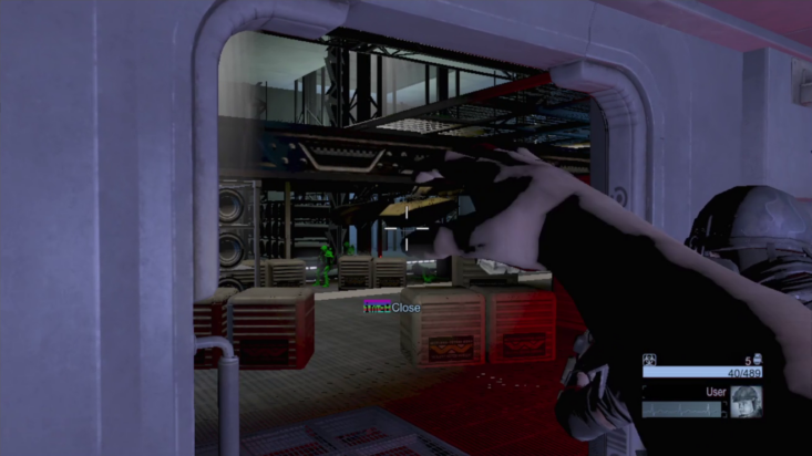 A screenshot from Colonial Marines shows the protagonist's arm outstretching into into the game frame, their hand formed into an odd claw.