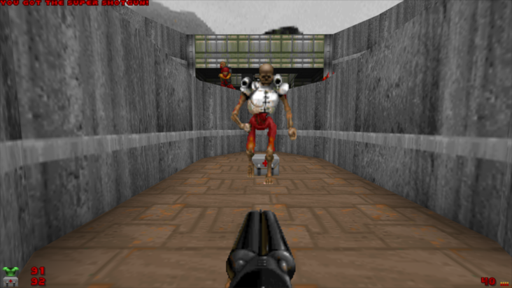 The player's gun points directly at a skeletal Imp in a screenshot from DOOM.
