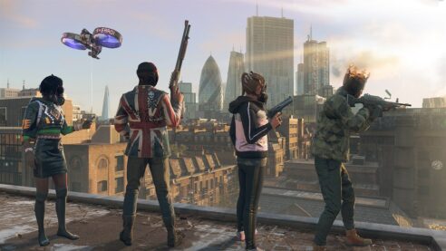 A screenshot from Watch Dogs Legion with four resistance fighters in various colorful outfits stand on a rooftop holding firearms and watching over the city