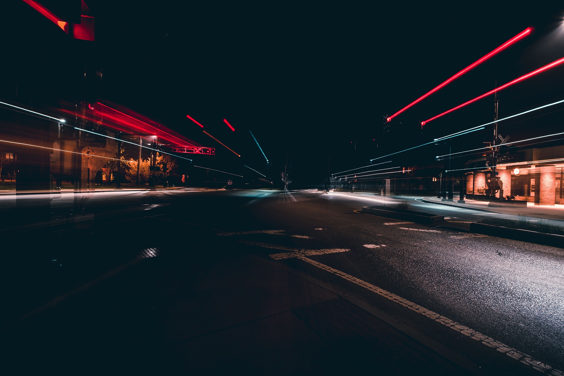 An overexposed nighttime photo shows a few colorful city lights stretched to the outer edges of the picture.