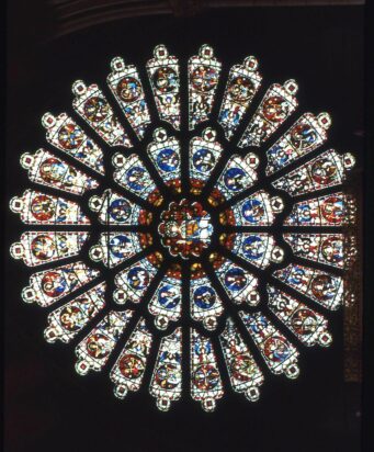 A close-up photo of Durham University's cathedral’s stained-glass rose window.