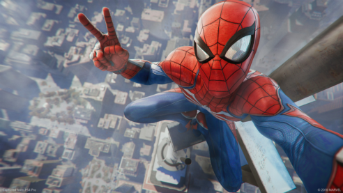 A screenshot from Spider-Man where the hero is at the top of the Empire state building taking a selfie looking down on NYC below giving a peace sign