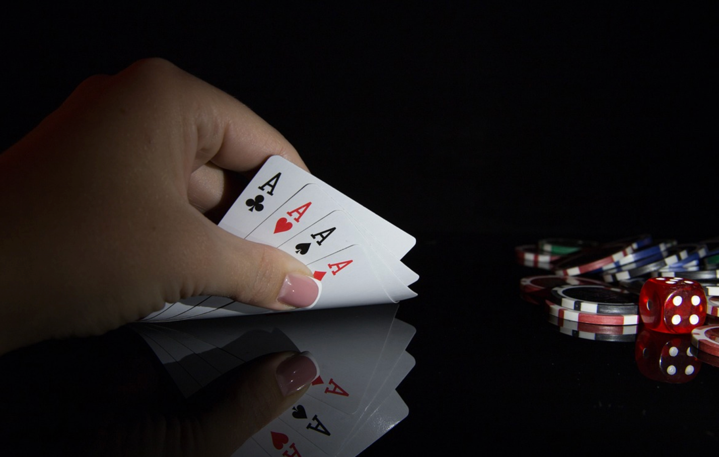 A hand holding a deck of cardsAI-generated content may be incorrect.