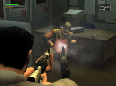 A screenshot from Freedom Fighters that's pretty blocky by today's standards but shows a man with an automatic rifle gunning down a soldier with a CCCP patch and hammer sickle posters in an office with an old CRT computer monitor and landline on the desk