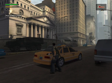 A screenshot from Freedom Fighters where the soldier character is standing in an empty desolate New York City street facing an NYPD station with an armored vehicle in front and a taxi for cover