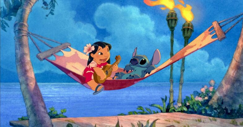 Lilo plays a ukelele while she and Stitch lounge in a floral-print hammock.