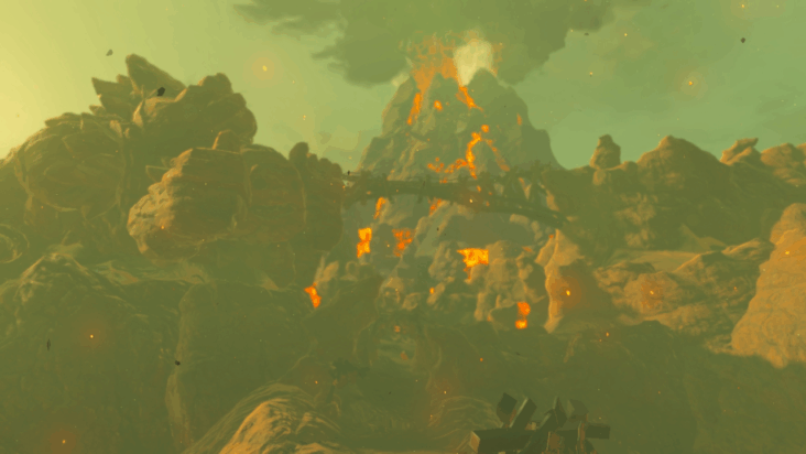 A wide shot of Goron City in Tears of the Kingdom features the volcano Death Mountain prominently in the background.